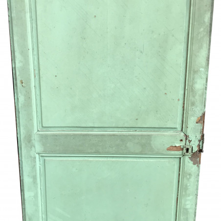 Ancienne porte verte de placard en bois