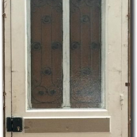 Ancienne porte d'entrée en bois et verre