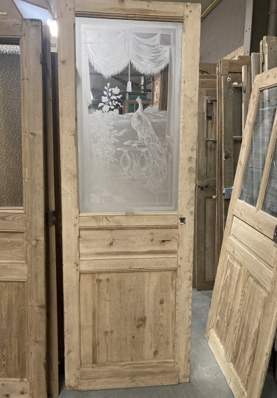 Porte ancienne en bois avec verre gravé paon